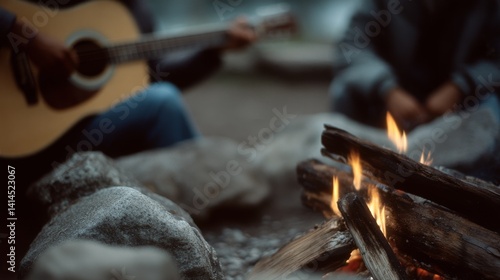 Obraz na płótnie A serene campfire scene with a guitar player in the background, warm flames flicker between logs, creating an inviting and musical outdoor gathering. w salonie