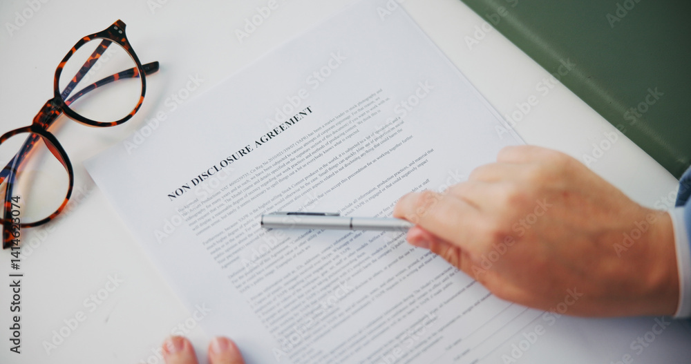 Hands, document and non disclosure agreement at office with reading, review and legal compliance. Person, attorney and paperwork for privacy, secret and check information with contract from above