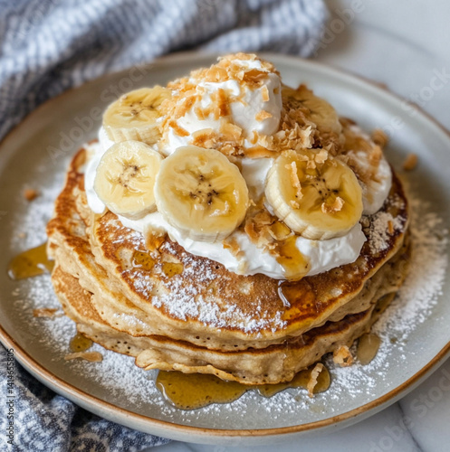 Obraz na płótnie coconut and banana pancakes with whipped cream on top w salonie