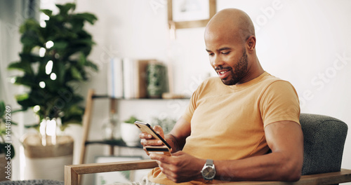 Obraz na płótnie Home, black man and phone with credit card for ecommerce, password information and payment. Sofa, male person and mobile with debit for online shopping, transaction and subscription for application w salonie