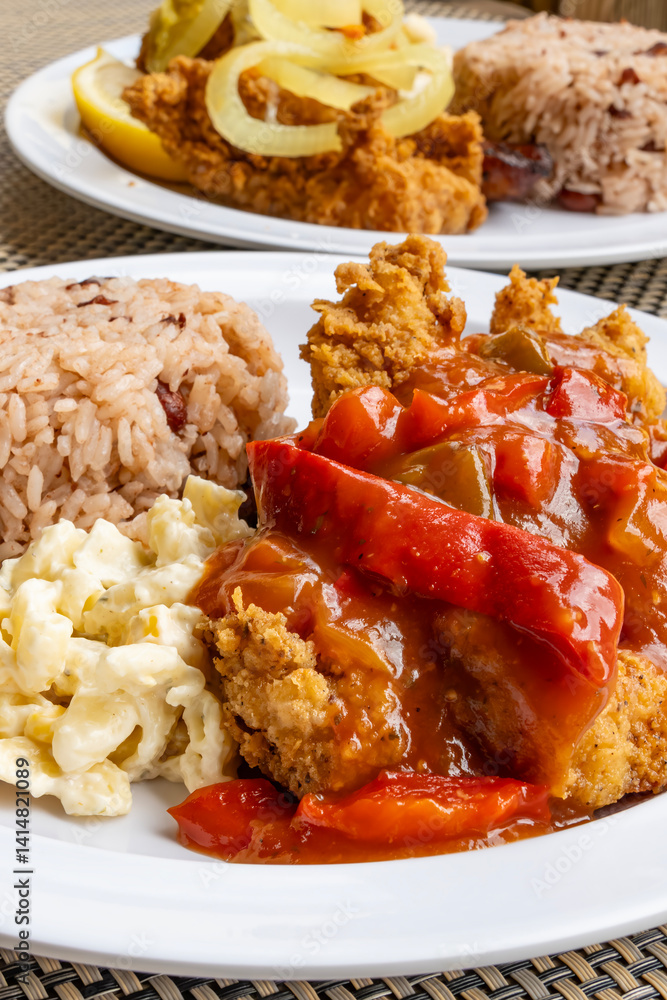 Deep Fried Groupers Served with Macoroni Salad, Red Bell Pepper and Rice and Beans