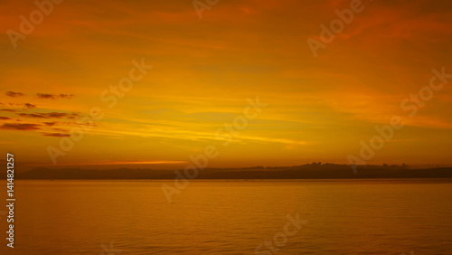 Stunning sunset over calm ocean waters