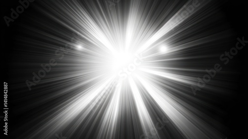 Bright white light rays burst from central point on black background.
