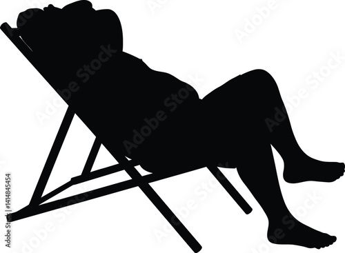 Silhouette of Large Man Relaxing in Swim Shorts on Beach