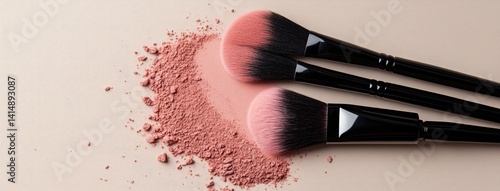 Obraz na płótnie Two makeup brushes rest on a beige surface, surrounded by soft loose powder, highlighting beauty essentials for a flawless look w salonie