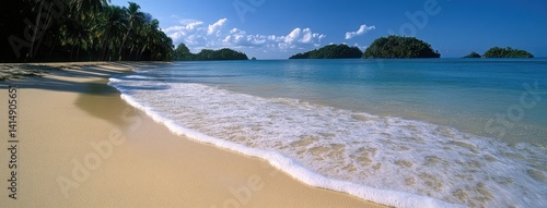 Obraz na płótnie Relaxing beach with turquoise waters and distant islands creates a serene getaway for vacationers enjoying sunny skies and gentle waves w salonie