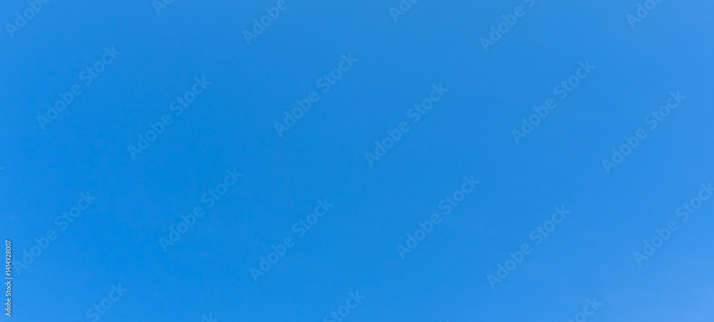 Low angle view and full frame of beautiful light blue sky without clouds in the morning or afternoon on sunny day used as natural background texture in decorative art work Low angle view and full frame of beautiful light blue sky without clouds in the morning or afternoon on sunny day used as natural background texture in decorative art work