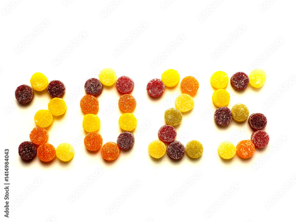Sign 2025 made of round sweets with sugar on white background.