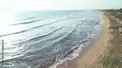 Wallpaper Mural Drone flight over a sandy beach, calm waves, deserted beach, camera tracking Torontodigital.ca