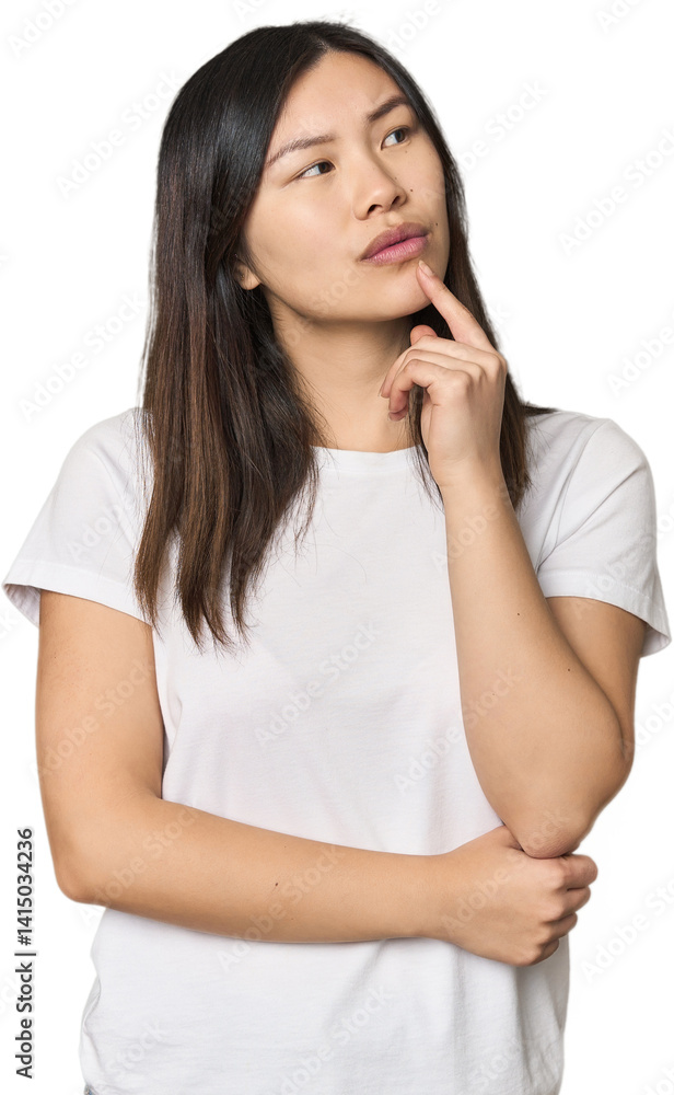 Young Chinese woman looking sideways with doubtful and skeptical expression. Young Chinese woman looking sideways with doubtful and skeptical expression.
