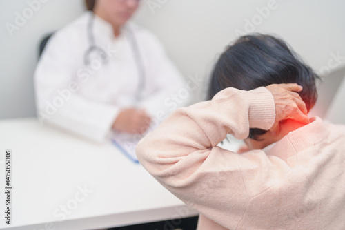 Elderly Woman having Shoulder and Neck and consulting doctor in hospital. Muscle painful due to Myofascial pain syndrome and Fibromyalgia, rheumatism, Scapular pain, Cervical Spine. ergonomic concept