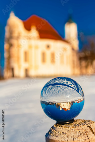 Obraz na płótnie Crystal ball alpine winter landscape shot with the famous Wieskirche church at Steingaden, Weilheim-Schongau, Bavaria, Germany w salonie