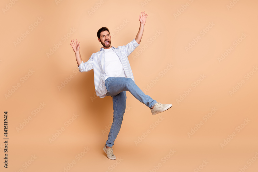 Young man in stylish casual outfit gesturing energetically with a cheerful expression and showcasing a dynamic pose Young man in stylish casual outfit gesturing energetically with a cheerful expression and showcasing a dynamic pose