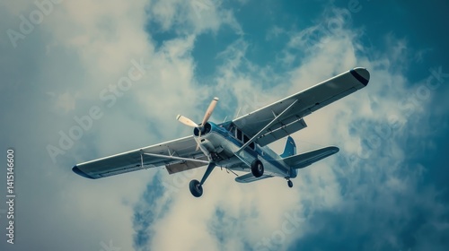 Low angle photo of white and blue dehavilland airplane Detected flying in the sky. 