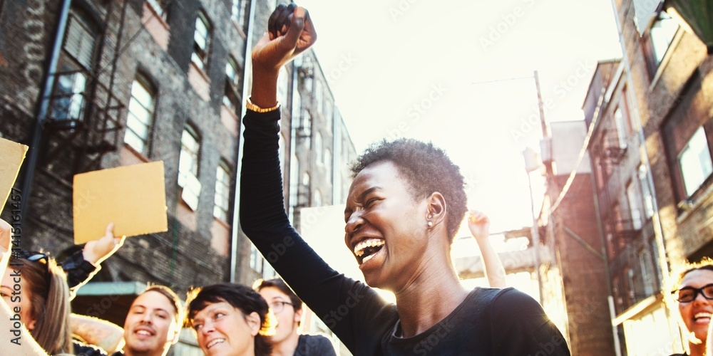 Φωτογραφία African American black woman celebrate with diverse group of people in a protest
