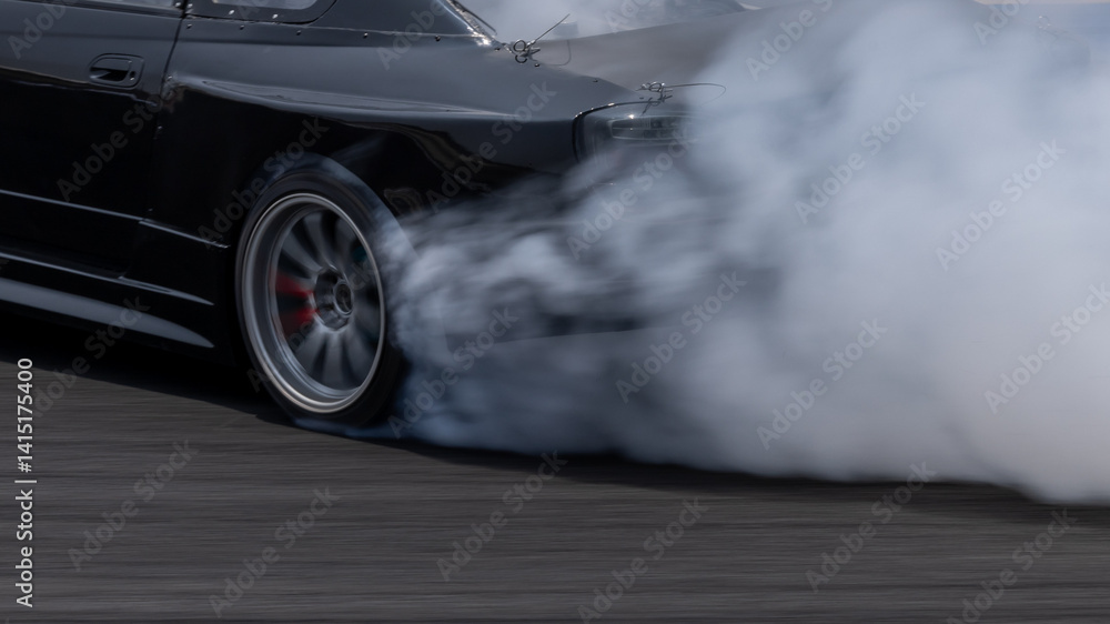 Car drifting on asphalt race track with lots of smoke from burning tires, Professional driver drift car on asphalt race track, Car motion blurred, Motorsport car drift.