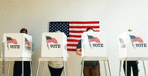 US election day, Diverse people at voting booth at US election station with American flag in background. Diverse people in line to vote at US election day. Vote for American democracy.