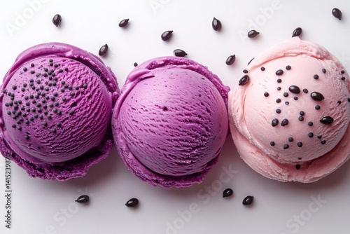Colorful scoops of delightful dessert with scattered toppings on bright background