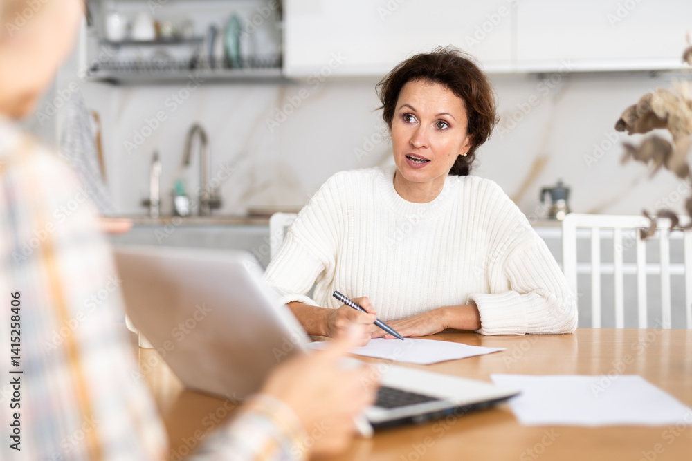 Real estate insurance agent advises a woman apartment owner