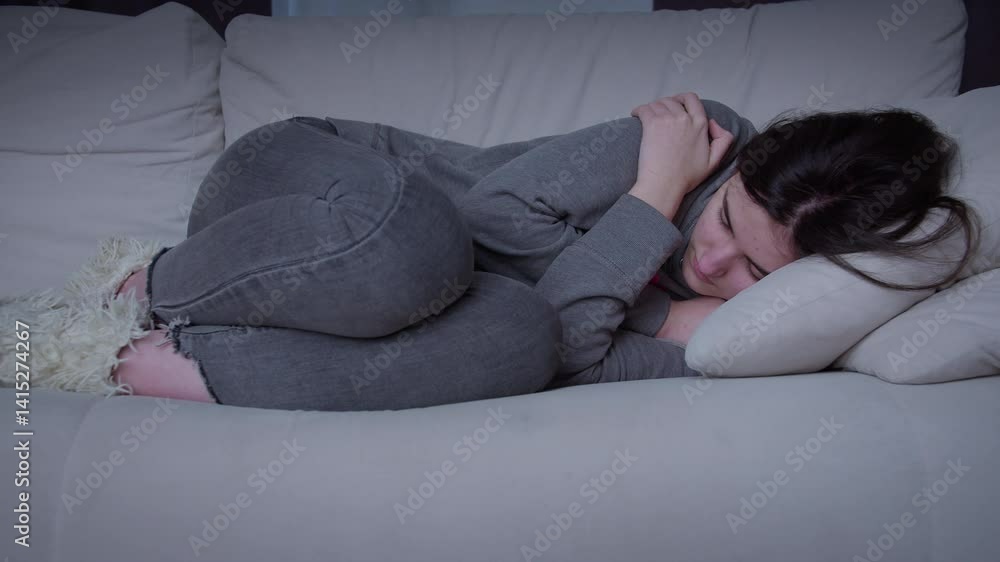 custom made wallpaper toronto digitalA frustrated young woman in her 20s is immersed in sad thoughts, thinking, looking away, feeling tense and unhappy. Hugs herself .Teenage problems, insecure teenager has life problems.
