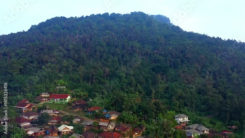 Aerial view of traditional village homes in Kasepuhan Pasir Eurih, Banten, captured in the morning light, showcasing harmony between local culture and nature.