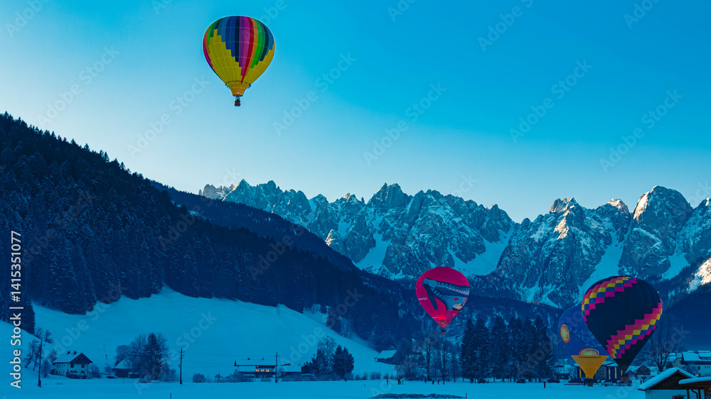 Alpine winter view with hot air balloons at Gosau, Abtenau, Salzkammergut, Salzburg, Austria