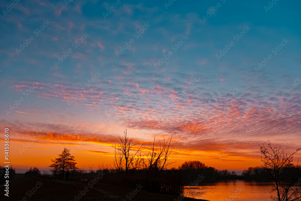 Sunset with reflections near Plattling, Isar, Bavaria, Germany