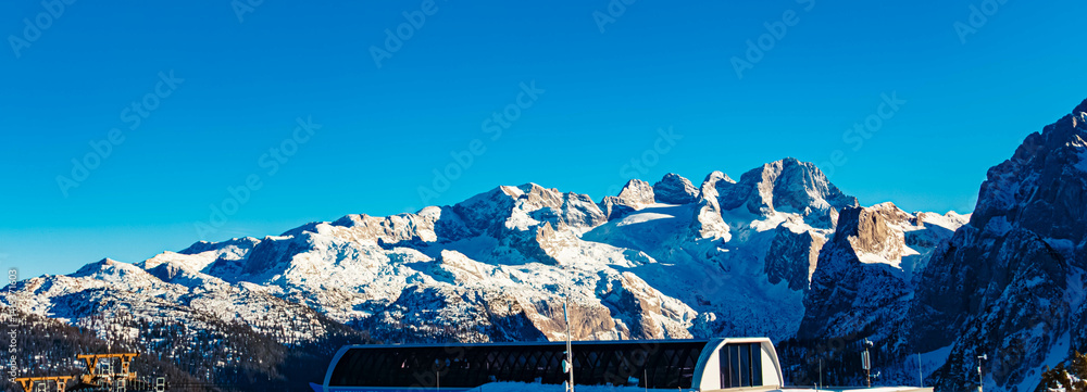 Alpine winter view with Mount Dachstein in the background at Mount Zwieselalm, Gosau, Abtenau, Salzkammergut, Salzburg, Austria