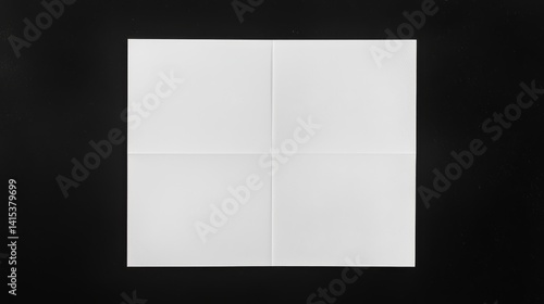A white sheet of paper is elegantly folded.