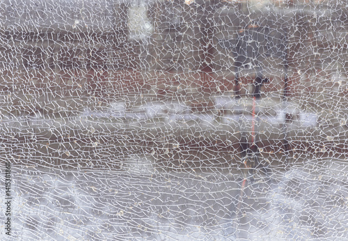 Obraz na płótnie Texture of cracked broken glass cracked by impact. Detail of broken tempered glass pane too many small irregular shape pieces holding together, Cracks on the glass surface background, Space for text. w salonie