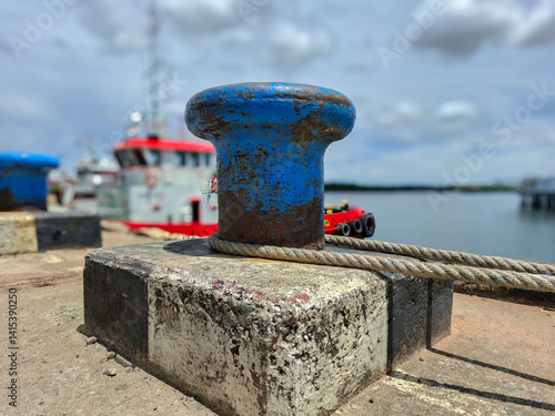 Obraz na płótnie Mooring bollard with rope to tie the ship when docked in the harbor