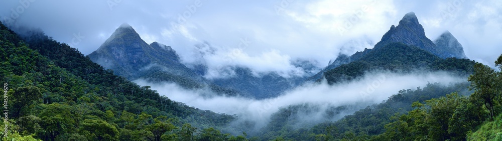 Majestic mountains enveloped in mist create a stunning panoramic view of a tranquil landscape. Majestic mountains enveloped in mist create a stunning panoramic view of a tranquil landscape.