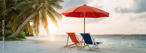 Obraz na płótnie Cozy Beach Chairs Under Vibrant Umbrella on Serene White Sand Shoreline at Sunset w salonie