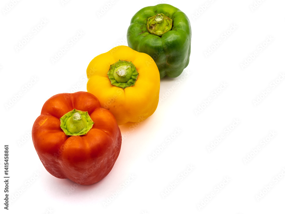 three colored bell peppers isolated on white background