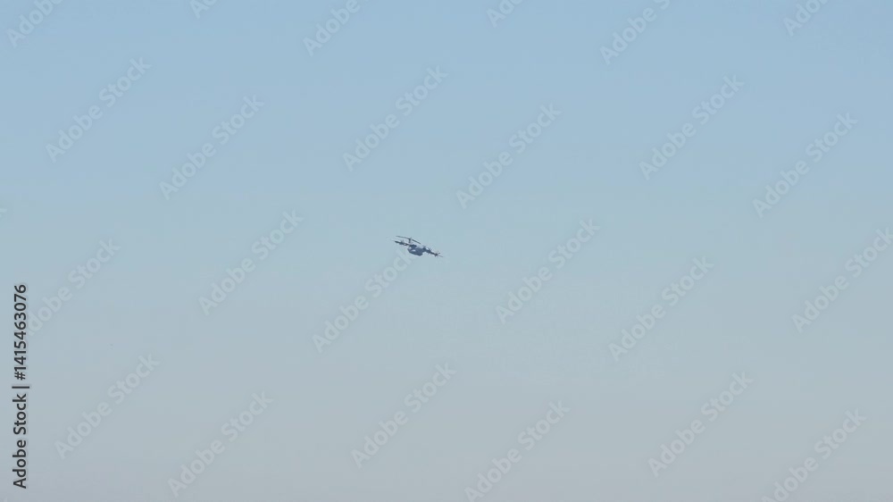 RAF Royal Air Force Airbus C.1 A400M Atlas military cargo plane on a low-level CDS cargo parachute drop exercise, blue sky RAF Royal Air Force Airbus C.1 A400M Atlas military cargo plane on a low-level CDS cargo parachute drop exercise, blue sky