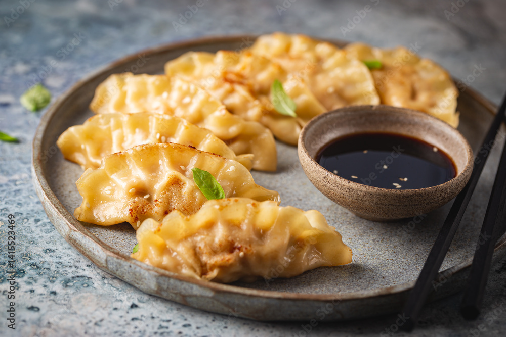 Asian dumplings with soy sauce, sesame seeds and microgreens. Traditional chinese dim sum dumplings.