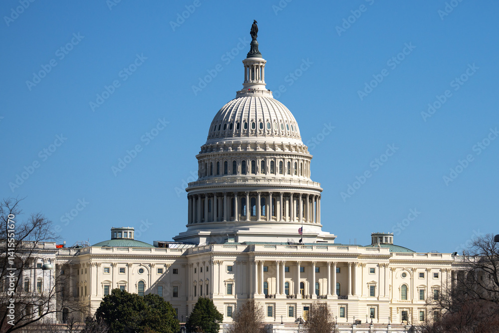 Naklejka premium The Capitol. Independence Day in USA. Capitol is freedom and justice in America. The dome of the Capitol in Washington DC. The United States flag on the Capitol building. American history.