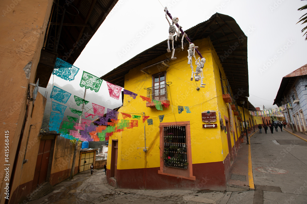 Beautiful Day of the Dead decorations hang in the historic downtown heart of Pinal de Amoles, Querétaro, Mexico.