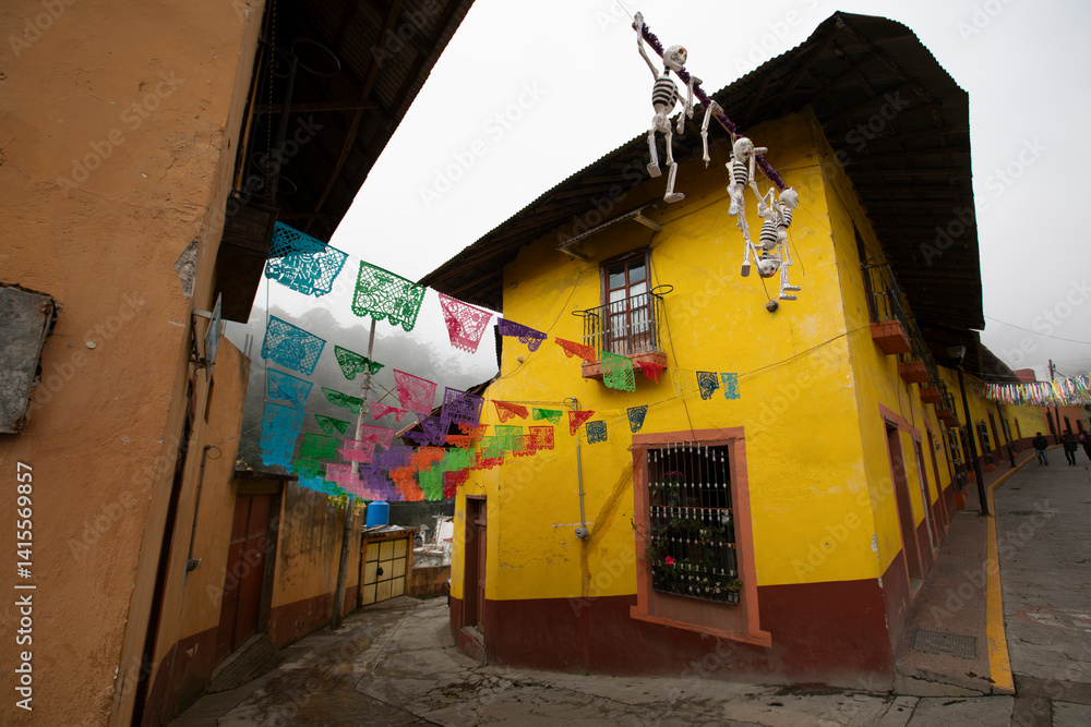 Beautiful Day of the Dead decorations hang in the historic downtown heart of Pinal de Amoles, Querétaro, Mexico.