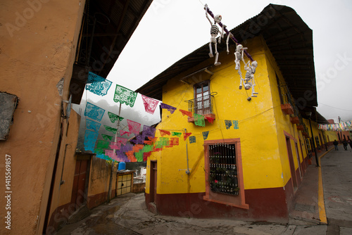 Obraz na płótnie Beautiful Day of the Dead decorations hang in the historic downtown heart of Pinal de Amoles, Querétaro, Mexico. w salonie