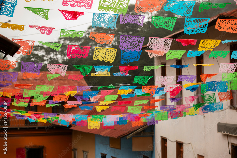 Beautiful Day of the Dead decorations hang in the historic downtown heart of Pinal de Amoles, Querétaro, Mexico.