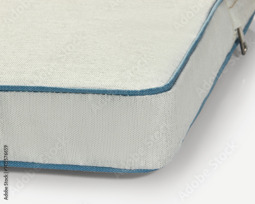 Obraz na płótnie Light beige fabric with blue piping detail showing high-quality manufacturing w salonie