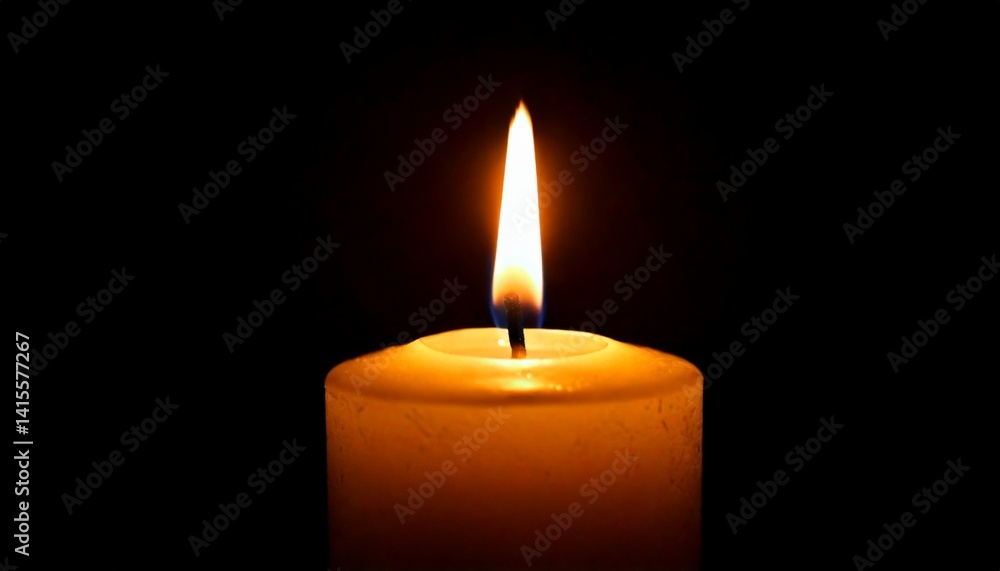 One candle burning slowly isolated on pitch black background One candle burning slowly isolated on pitch black background