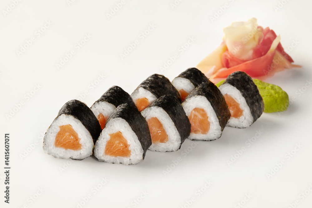 Triangular sushi rolls with salmon, wasabi and ginger showing japanese cuisine