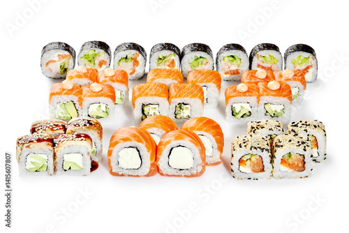 Obraz na płótnie Variety of delicious sushi rolls displayed on white background w salonie