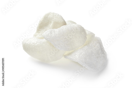 Obraz na płótnie Prawn crackers, small pile of crunchy shrimp chips on white background w salonie