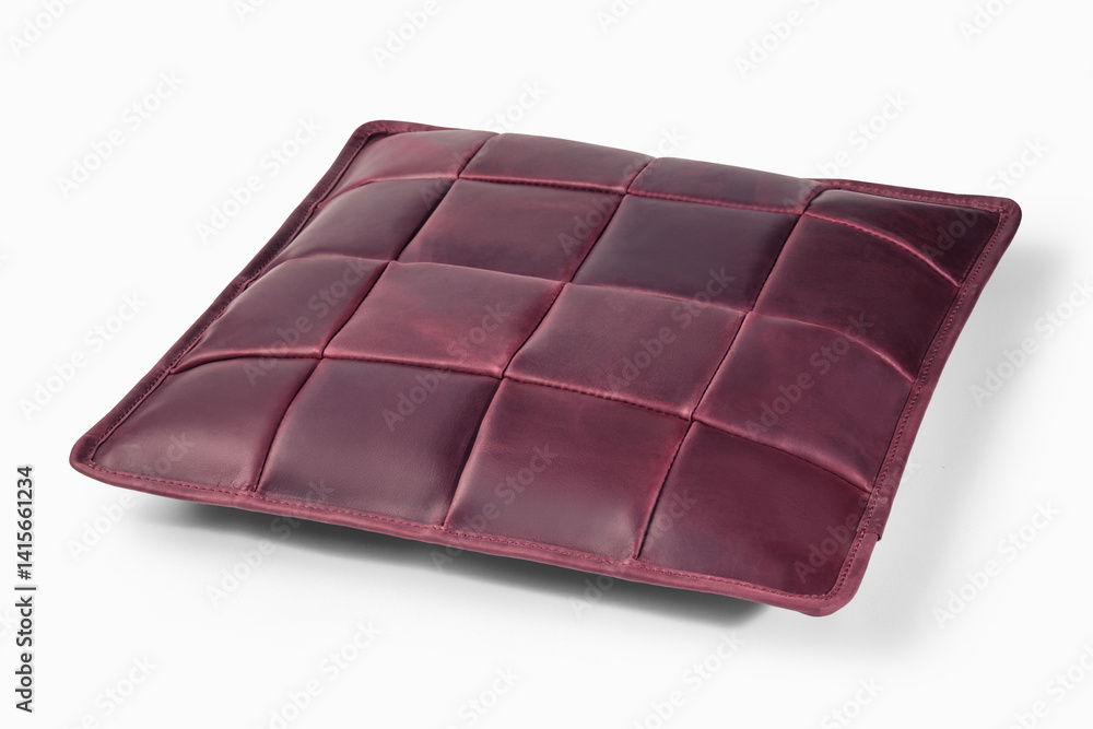 Elegant burgundy leather cushion resting on white background