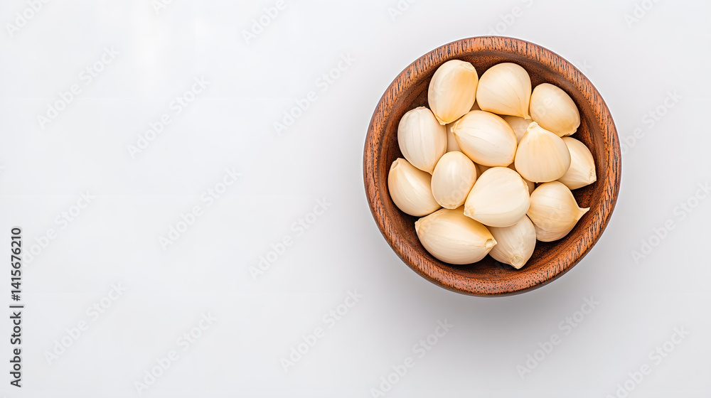 White peeled garlic cloves, isolated on a white background White peeled garlic cloves, isolated on a white background