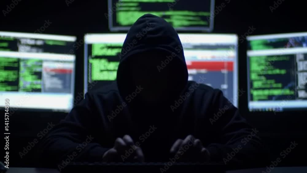 Anonymous Hooded Hacker Typing Code in Dark Room - Cybercrime, Hacking, and Network Security Breach Concept Video Anonymous Hooded Hacker Typing Code in Dark Room - Cybercrime, Hacking, and Network Security Breach Concept Video