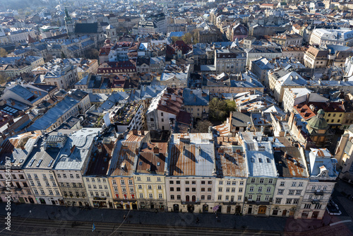Obraz na płótnie View from above of the main square of Lviv. People are walking around the town w salonie